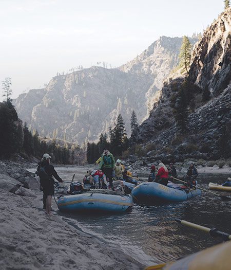 A group of people whitewater rafting in a gorge