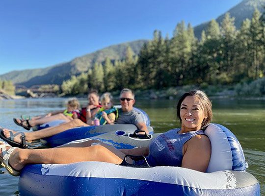 A group of people whitewater rafting