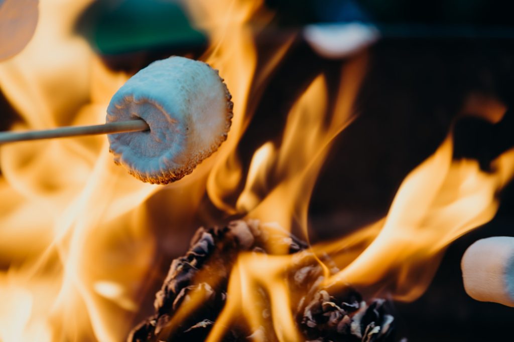 A marshmallow roasting over a fire