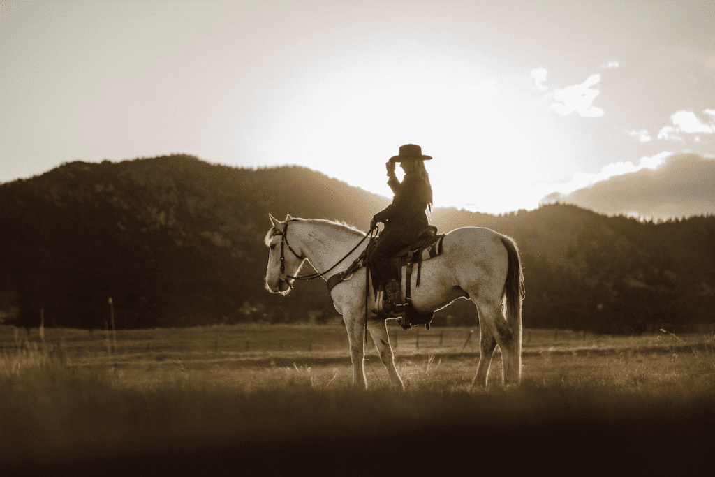 A woman riding a horse