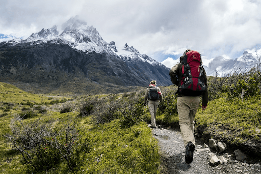 Two people hiking in mountainous terrain