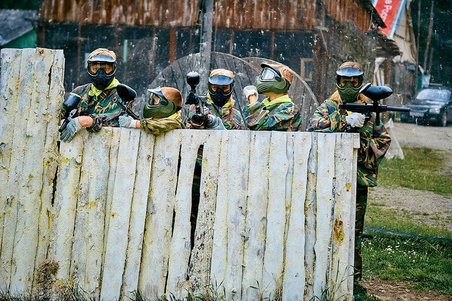 A group of people playing paintball