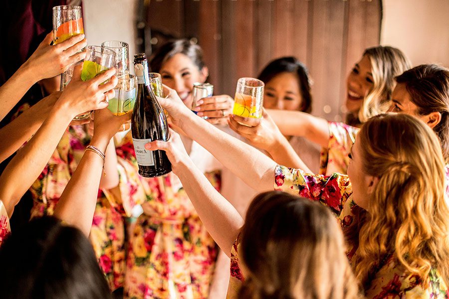 A group of women toasting glasses